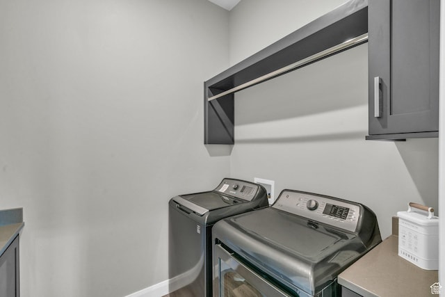 1498 W Torrey Pines Rd, Hurricane, UT 84737 - laundry area featuring washing machine and clothes dryer, cabinet space, and baseboards