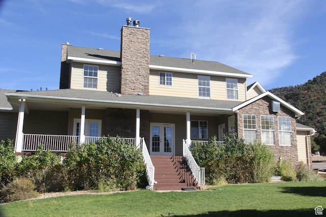1627 W 950 S, Parowan, UT 84761 - view of front facade with stairs, a porch, a front yard, french doors, and a chimney