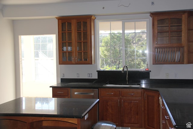 1627 W 950 S, Parowan, UT 84761 - kitchen featuring a sink, a kitchen island, plenty of natural light, and glass insert cabinets