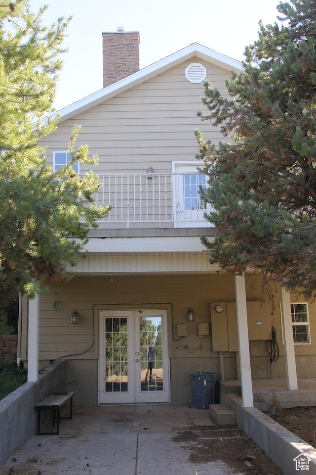 1627 W 950 S, Parowan, UT 84761 - rear view of house with french doors, a balcony, a chimney, and a patio