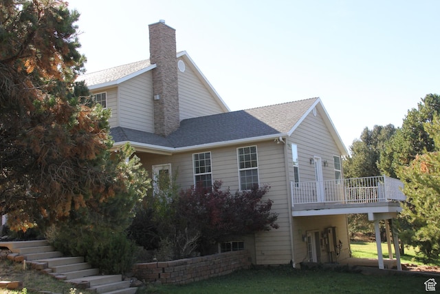 1627 W 950 S, Parowan, UT 84761 - view of property exterior with a chimney, stairway, a lawn, and roof with shingles