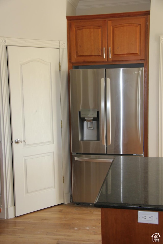 1627 W 950 S, Parowan, UT 84761 - kitchen with stainless steel fridge with ice dispenser, brown cabinetry, dark stone counters, light wood-style floors, and crown molding
