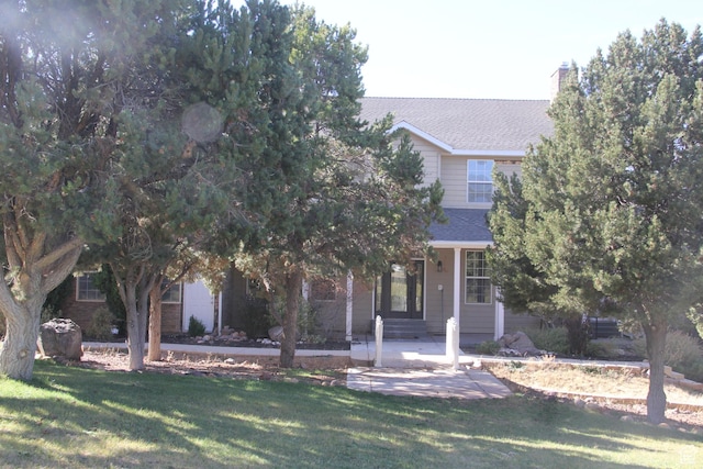 1627 W 950 S, Parowan, UT 84761 - obstructed view of property featuring a front lawn, roof with shingles, and a chimney