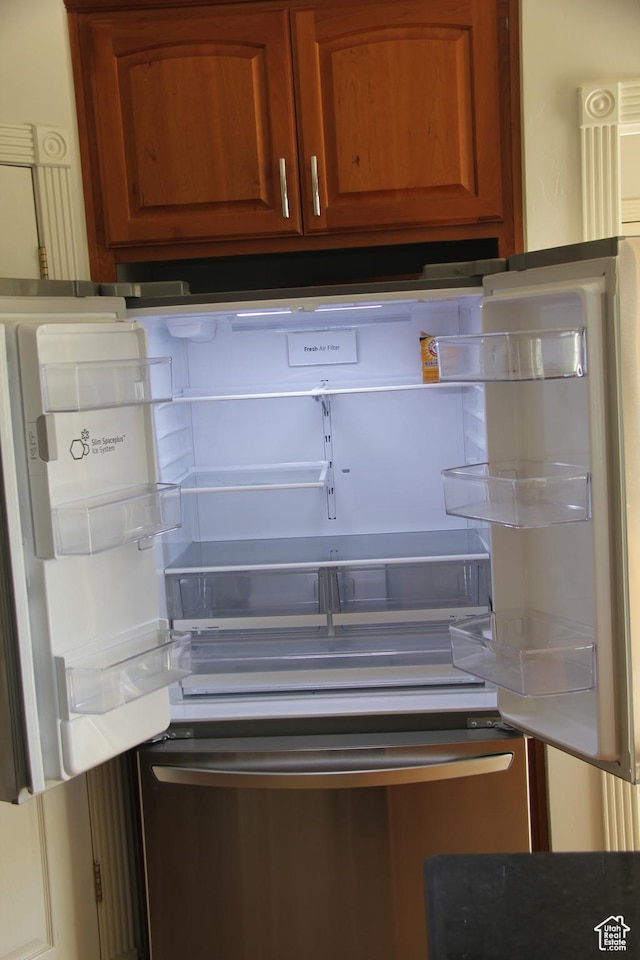 1627 W 950 S, Parowan, UT 84761 - detailed view of freestanding refrigerator and brown cabinetry