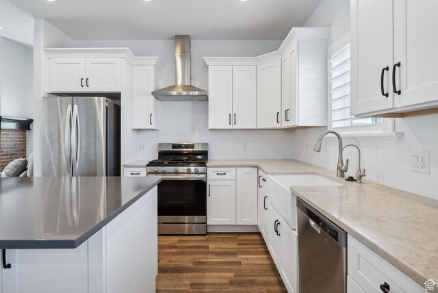 967 W Yamada Ct S, Syracuse, UT 84075 - kitchen featuring stainless steel appliances, wall chimney range hood, white cabinets, and dark wood-style floors