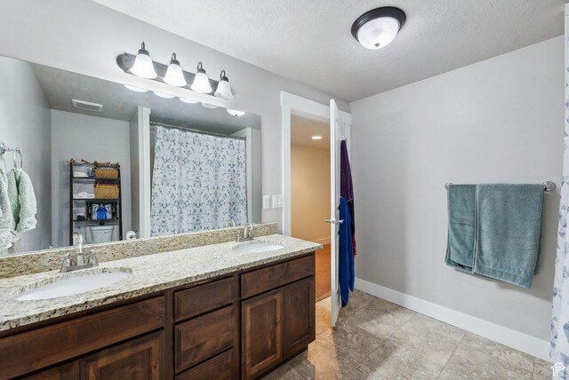 967 W Yamada Ct S, Syracuse, UT 84075 - bathroom with double vanity and a textured ceiling