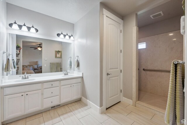 967 W Yamada Ct S, Syracuse, UT 84075 - bathroom featuring ensuite bath, double vanity, a ceiling fan, and a walk in shower