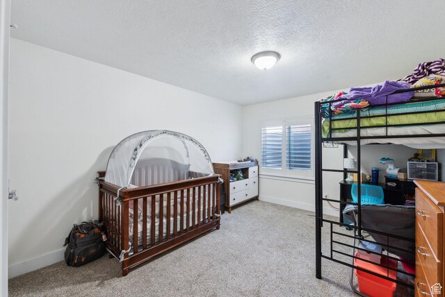 967 W Yamada Ct S, Syracuse, UT 84075 - carpeted bedroom featuring a textured ceiling and baseboards