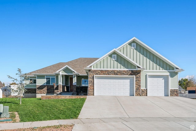 967 W Yamada Ct S, Syracuse, UT 84075 - craftsman-style house featuring board and batten siding, stone siding, driveway, a front yard, and an attached garage
