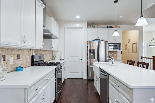 967 W Yamada Ct S, Syracuse, UT 84075 - kitchen featuring appliances with stainless steel finishes, wall chimney exhaust hood, dark wood-style floors, white cabinets, and light countertops
