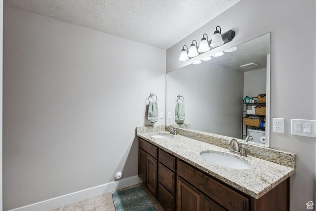 967 W Yamada Ct S, Syracuse, UT 84075 - bathroom with double vanity, tile patterned floors, and a textured ceiling