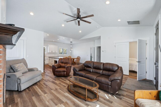967 W Yamada Ct S, Syracuse, UT 84075 - living room featuring ceiling fan, vaulted ceiling, light wood-style flooring, and recessed lighting