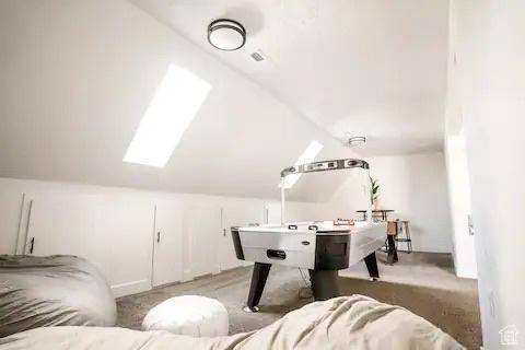 1065 E 22nd St, Ogden, UT 84401 - rec room with lofted ceiling and carpet