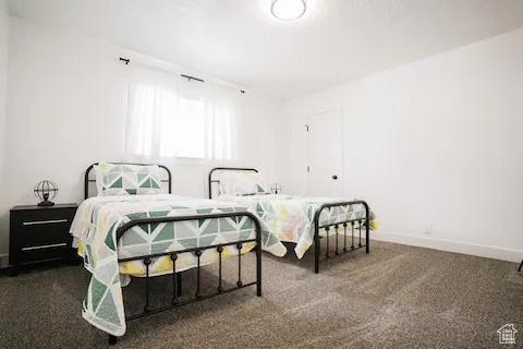 1065 E 22nd St, Ogden, UT 84401 - carpeted bedroom featuring baseboards