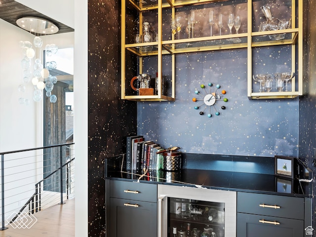 kitchen featuring hardwood / wood-style floors and beverage cooler