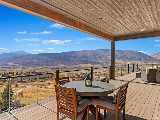wooden terrace featuring a mountain view