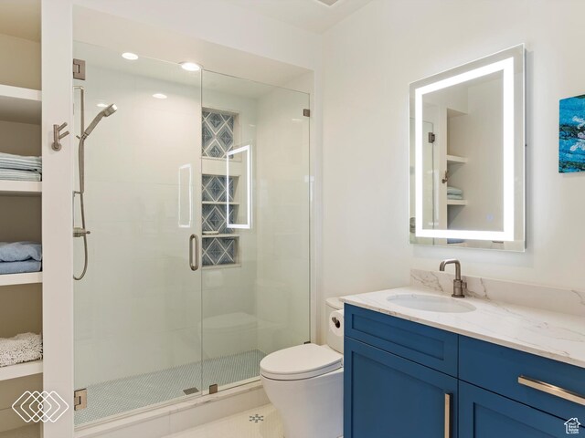 5731 E Porcupine Ridge Dr N, Eden, UT 84310 - full bathroom featuring vanity, toilet, and a stall shower