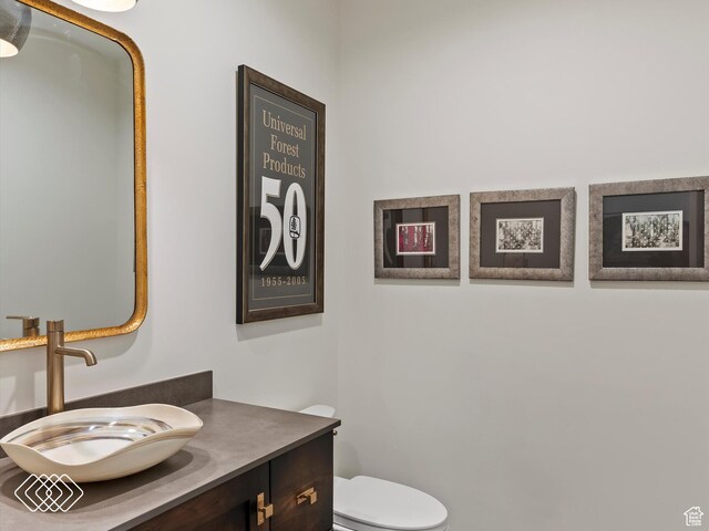 5731 E Porcupine Ridge Dr N, Eden, UT 84310 - bathroom featuring vanity and toilet