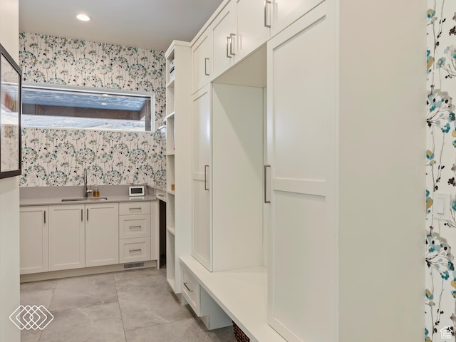 bathroom with vanity and tile patterned floors