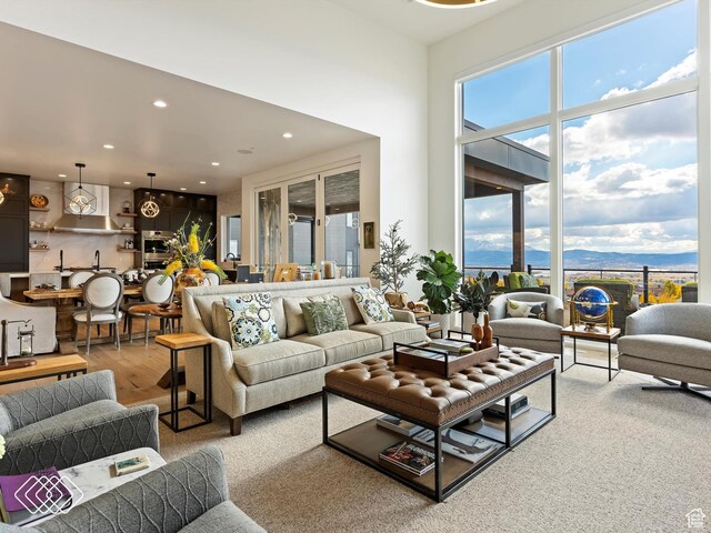 5731 E Porcupine Ridge Dr N, Eden, UT 84310 - living room with recessed lighting, wood finished floors, and a mountain view