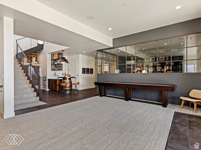 interior space featuring dark hardwood / wood-style flooring and indoor bar