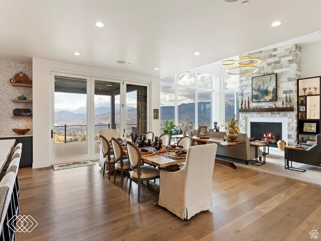 5731 E Porcupine Ridge Dr N, Eden, UT 84310 - dining room with a mountain view, wood-type flooring, healthy amount of natural light, and recessed lighting