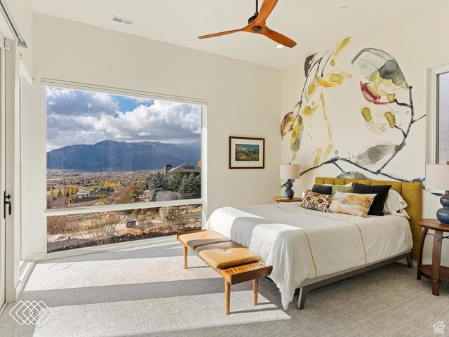 5731 E Porcupine Ridge Dr N, Eden, UT 84310 - bedroom featuring a mountain view, a ceiling fan, and multiple windows