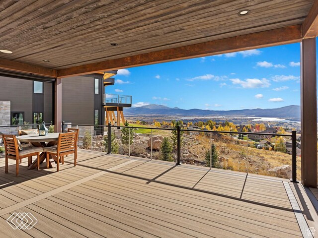 5731 E Porcupine Ridge Dr N, Eden, UT 84310 - wooden deck featuring a mountain view and outdoor dining space