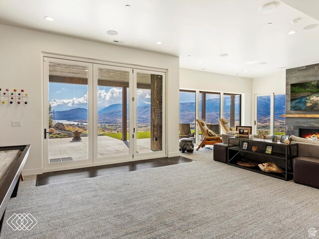 5731 E Porcupine Ridge Dr N, Eden, UT 84310 - living area with a mountain view, a large fireplace, recessed lighting, and baseboards