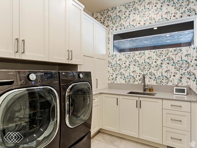 5731 E Porcupine Ridge Dr N, Eden, UT 84310 - washroom featuring cabinet space, wallpapered walls, washer and dryer, and light tile patterned flooring