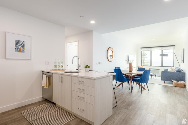 2303 Deer Hollow Rd Unit 1236, Park City, UT 84060 - kitchen with light wood-type flooring, kitchen peninsula, stainless steel dishwasher, and sink