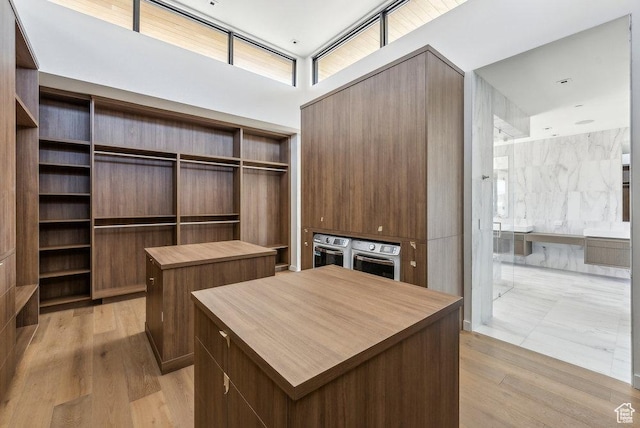 3821 Pinnacle Sky Loop, Park City, UT 84098 - walk in closet with light wood-type flooring and a high ceiling