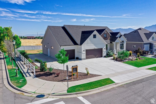 12751 S Harvest Ln W Unit 6, Riverton, UT 84096 - modern inspired farmhouse featuring fence, a garage, board and batten siding, driveway, and a mountain view