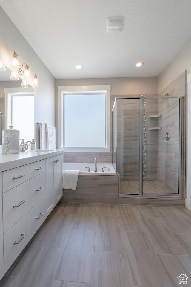 12751 S Harvest Ln W Unit 6, Riverton, UT 84096 - full bath with a shower stall, vanity, and a garden tub