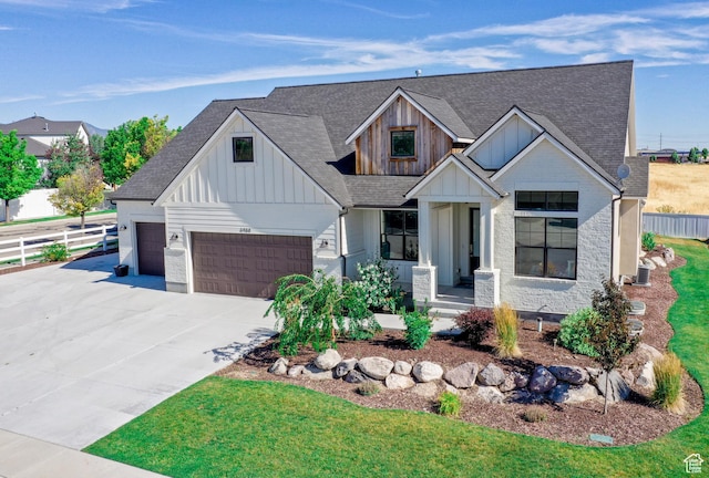 12751 S Harvest Ln W Unit 6, Riverton, UT 84096 - modern farmhouse with board and batten siding, a shingled roof, fence, and an attached garage