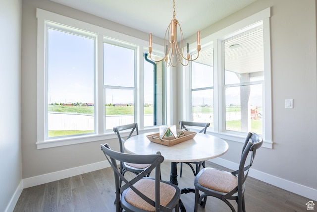 12751 S Harvest Ln W Unit 6, Riverton, UT 84096 - dining space featuring baseboards, a notable chandelier, and dark wood finished floors