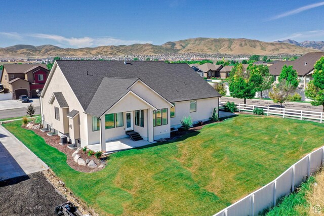 12751 S Harvest Ln W Unit 6, Riverton, UT 84096 - back of property featuring stucco siding, a mountain view, and entry steps