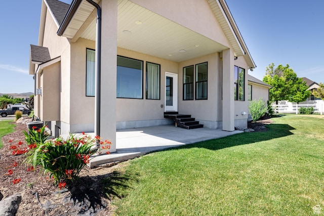 12751 S Harvest Ln W Unit 6, Riverton, UT 84096 - exterior space with stucco siding, a front lawn, roof with shingles, and entry steps