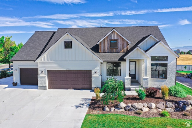 12751 S Harvest Ln W Unit 6, Riverton, UT 84096 - modern farmhouse style home featuring an attached garage, a shingled roof, board and batten siding, and concrete driveway