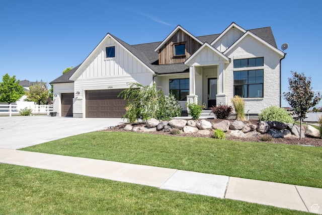 12751 S Harvest Ln W Unit 6, Riverton, UT 84096 - modern inspired farmhouse with a front yard, a garage, board and batten siding, and concrete driveway
