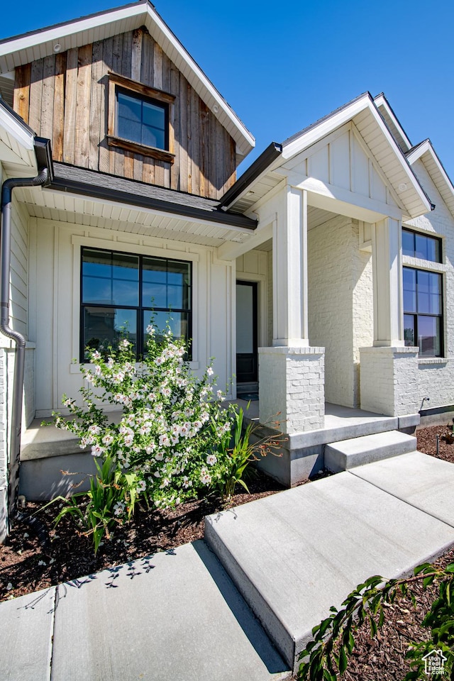 12751 S Harvest Ln W Unit 6, Riverton, UT 84096 - property entrance featuring covered porch and board and batten siding