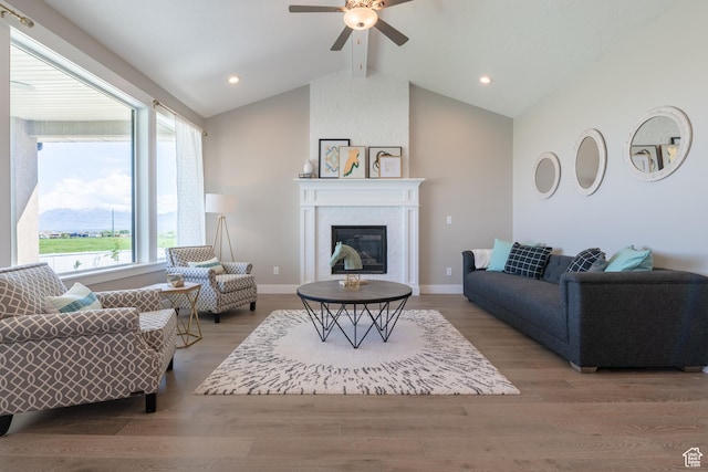 12751 S Harvest Ln W Unit 6, Riverton, UT 84096 - living room with lofted ceiling with beams, baseboards, a ceiling fan, a fireplace, and wood finished floors