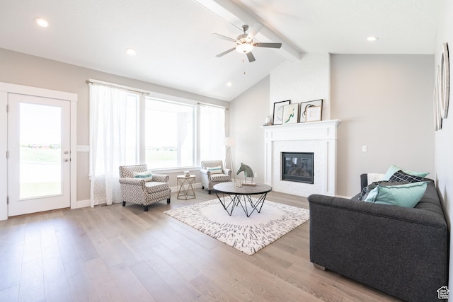 12751 S Harvest Ln W Unit 6, Riverton, UT 84096 - living room with a ceiling fan, vaulted ceiling with beams, a fireplace, wood finished floors, and baseboards