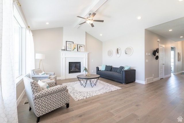 12751 S Harvest Ln W Unit 6, Riverton, UT 84096 - living area with wood finished floors, lofted ceiling with beams, ceiling fan, and visible vents