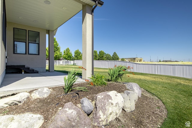 12751 S Harvest Ln W Unit 6, Riverton, UT 84096 - view of yard featuring a fenced backyard and a patio area