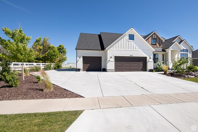 12751 S Harvest Ln W Unit 6, Riverton, UT 84096 - modern inspired farmhouse featuring a garage, board and batten siding, concrete driveway, and fence