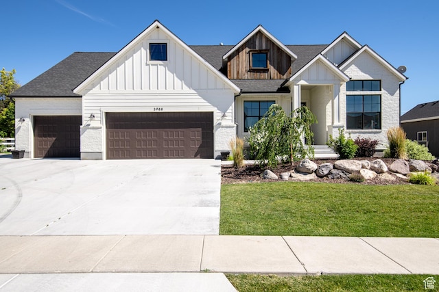 12751 S Harvest Ln W Unit 6, Riverton, UT 84096 - modern farmhouse with roof with shingles, board and batten siding, driveway, a front lawn, and a garage