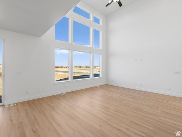 1018 S 3250 E Unit 128, Spanish Fork, UT 84660 - unfurnished living room featuring ceiling fan, high vaulted ceiling, and light wood-type flooring