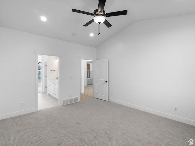 1018 S 3250 E Unit 128, Spanish Fork, UT 84660 - unfurnished bedroom featuring connected bathroom, ceiling fan, light colored carpet, and lofted ceiling