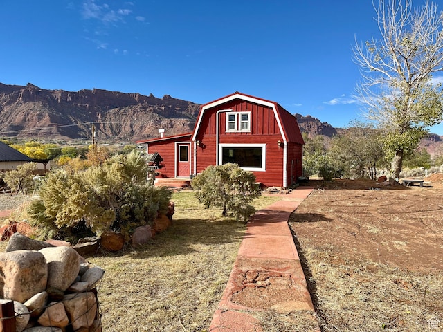 2060 Solar Terrace Dr, Moab, UT 84532 - view of front of house featuring a gambrel roof and a mountain view